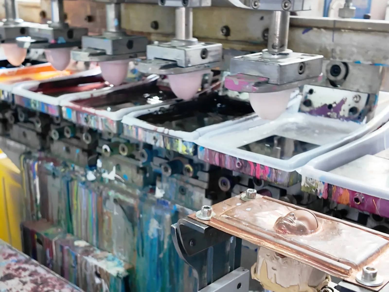 Custom vinyl toys are undergoing automated coloring.