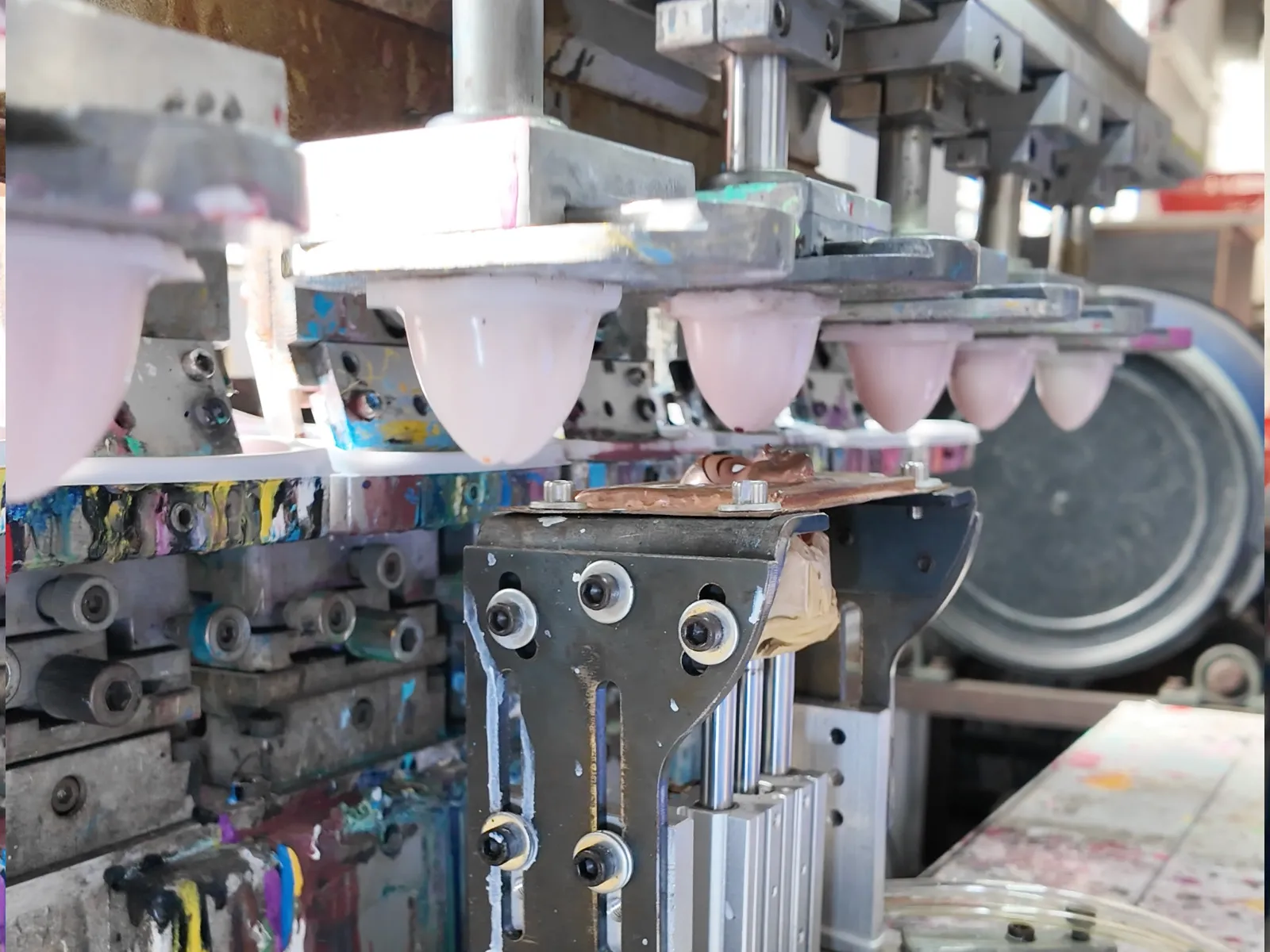 Batch automated coloring process of vinyl figures.