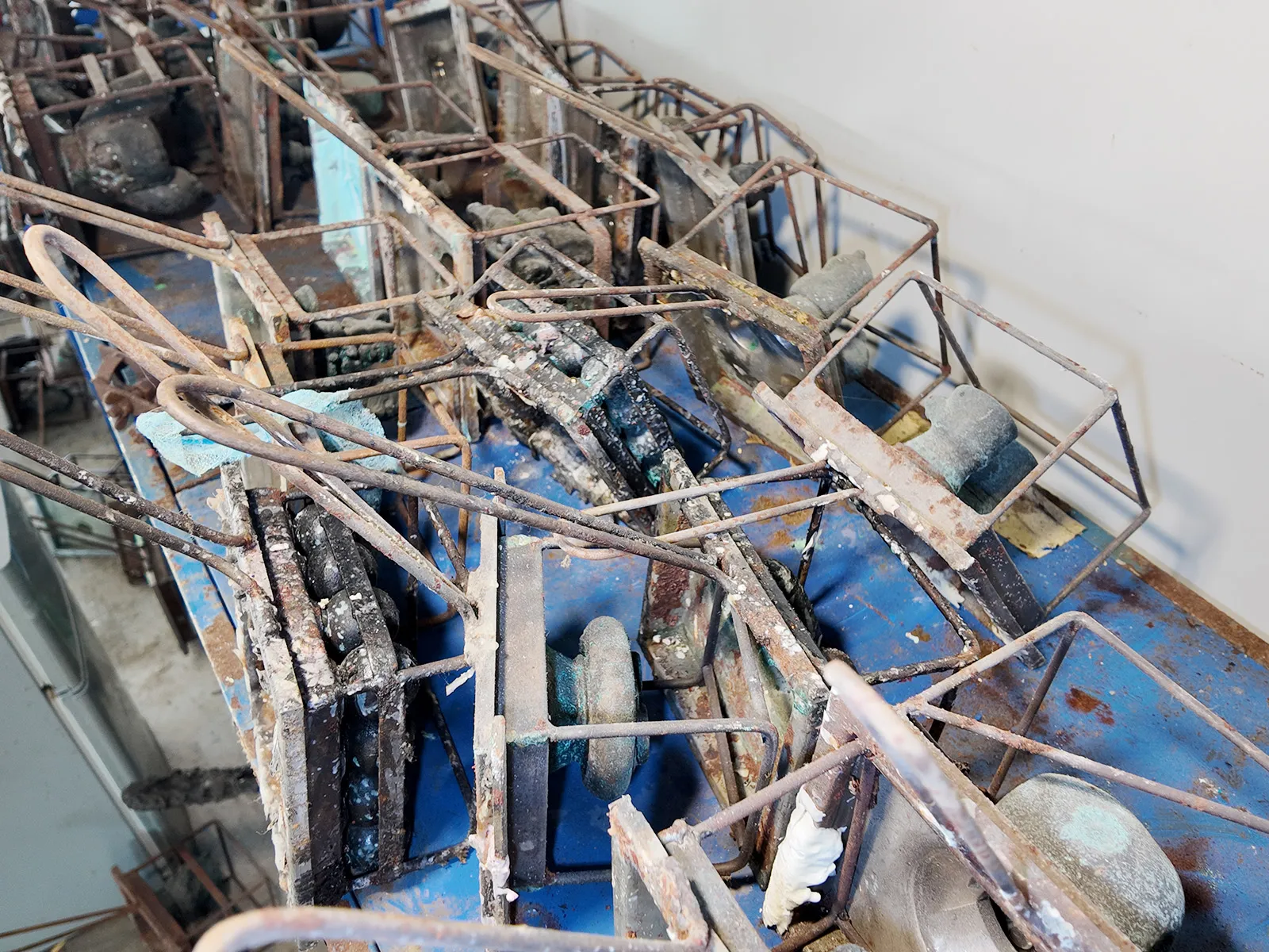 Spare vinyl toy molds are neatly stored in the warehouse.