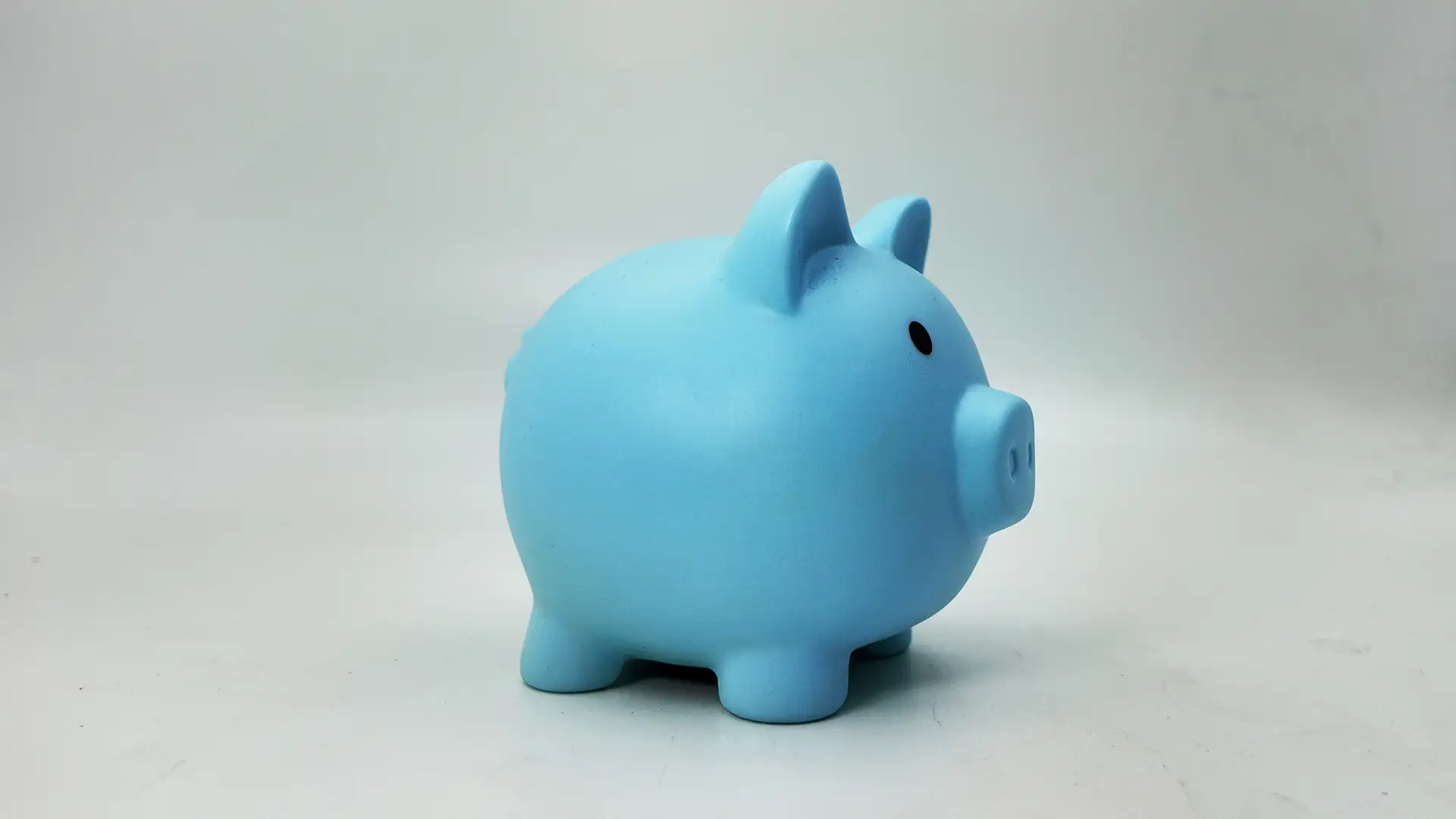 This blue piggy bank boasts a timeless, classic design