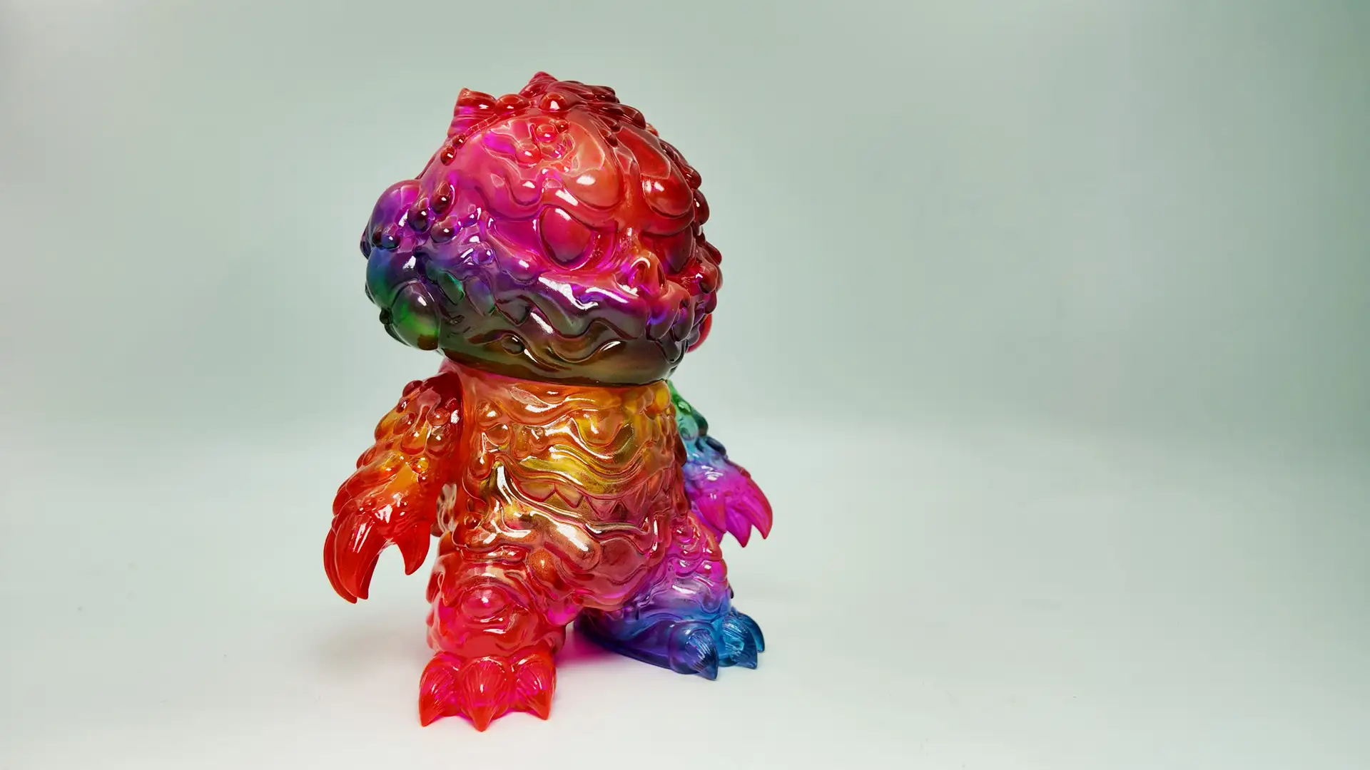 The translucent sofubi toy features a specially crafted gradient color finish